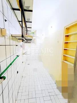 Empty room with white tiles on the floor and walls. - image 6
