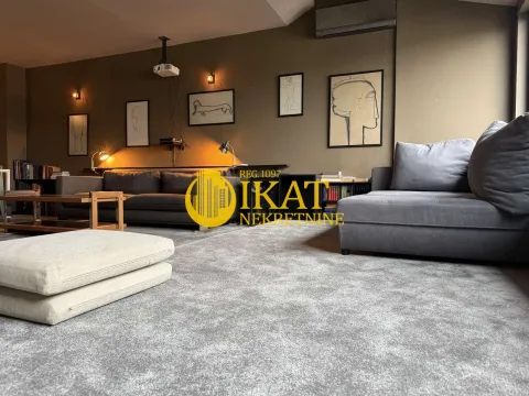 Spacious living room with grey sofas and carpet. - image 2