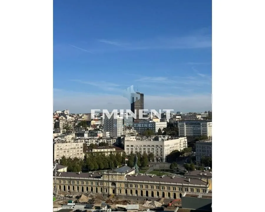 View from the window of the cityscape and surrounding buildings.