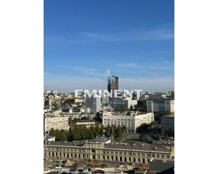 View from the window of the cityscape and surrounding buildings. - image 21