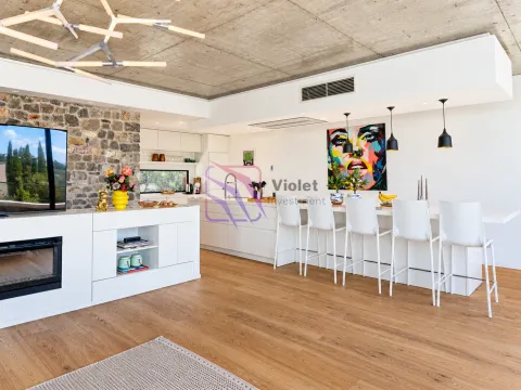 Spacious living room with a modern kitchen, breakfast bar, and dining area. - image 8