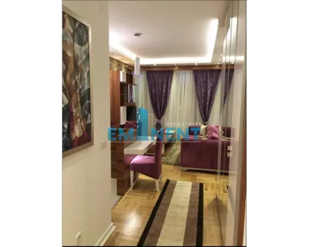 View from the hallway into the furnished living room with sofa set and dining area. - image 5
