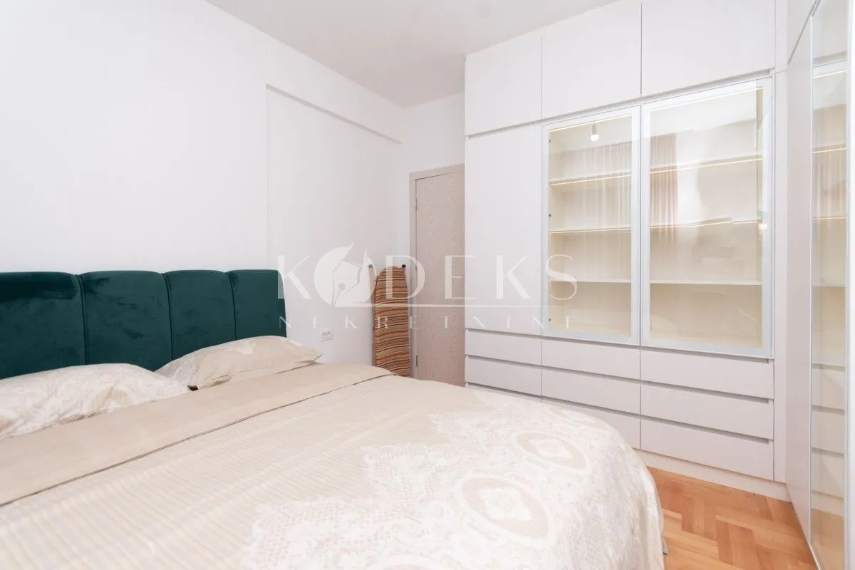 Bedroom with a double bed and a large built-in wardrobe.