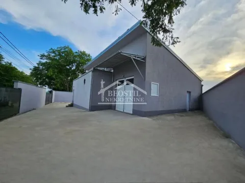 Exterior view of the building with a paved yard. - image 11
