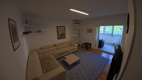 Spacious living room with a sectional sofa and access to the terrace. - image 10