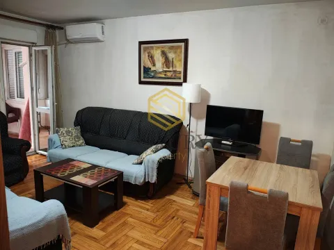 Living room with a sofa, dining table, and access to the terrace. - image 2