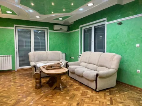 Living room with seating furniture and wooden flooring. - image 7