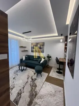 Modern living room with a sofa, coffee table, and dining area. - image 2