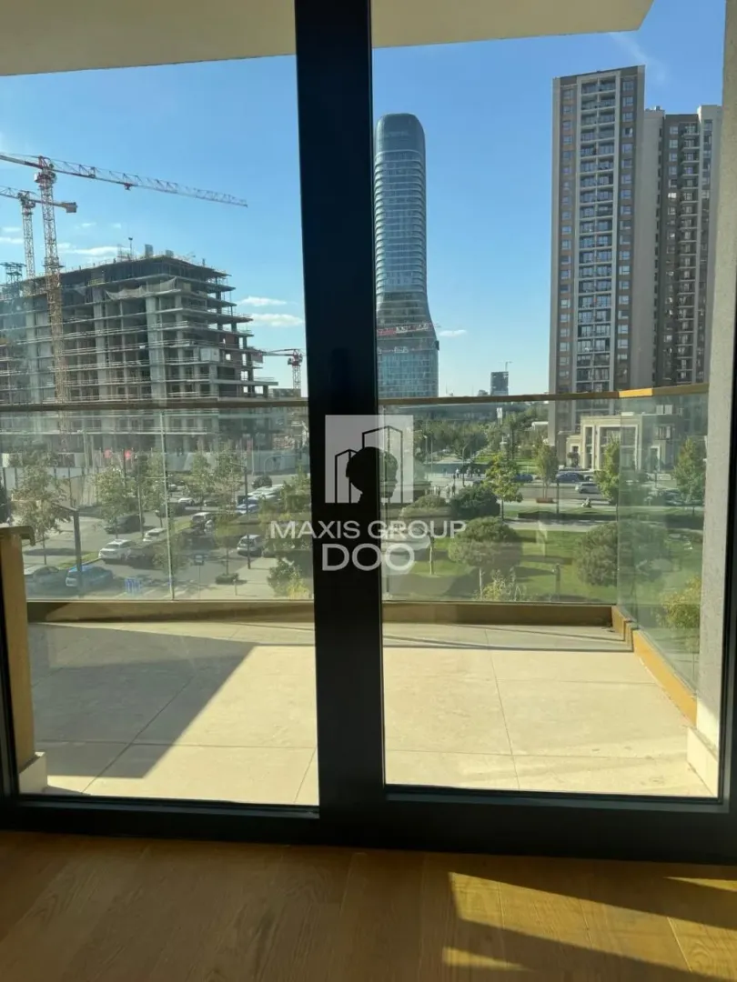 View from the terrace facing the urban environment and modern buildings.