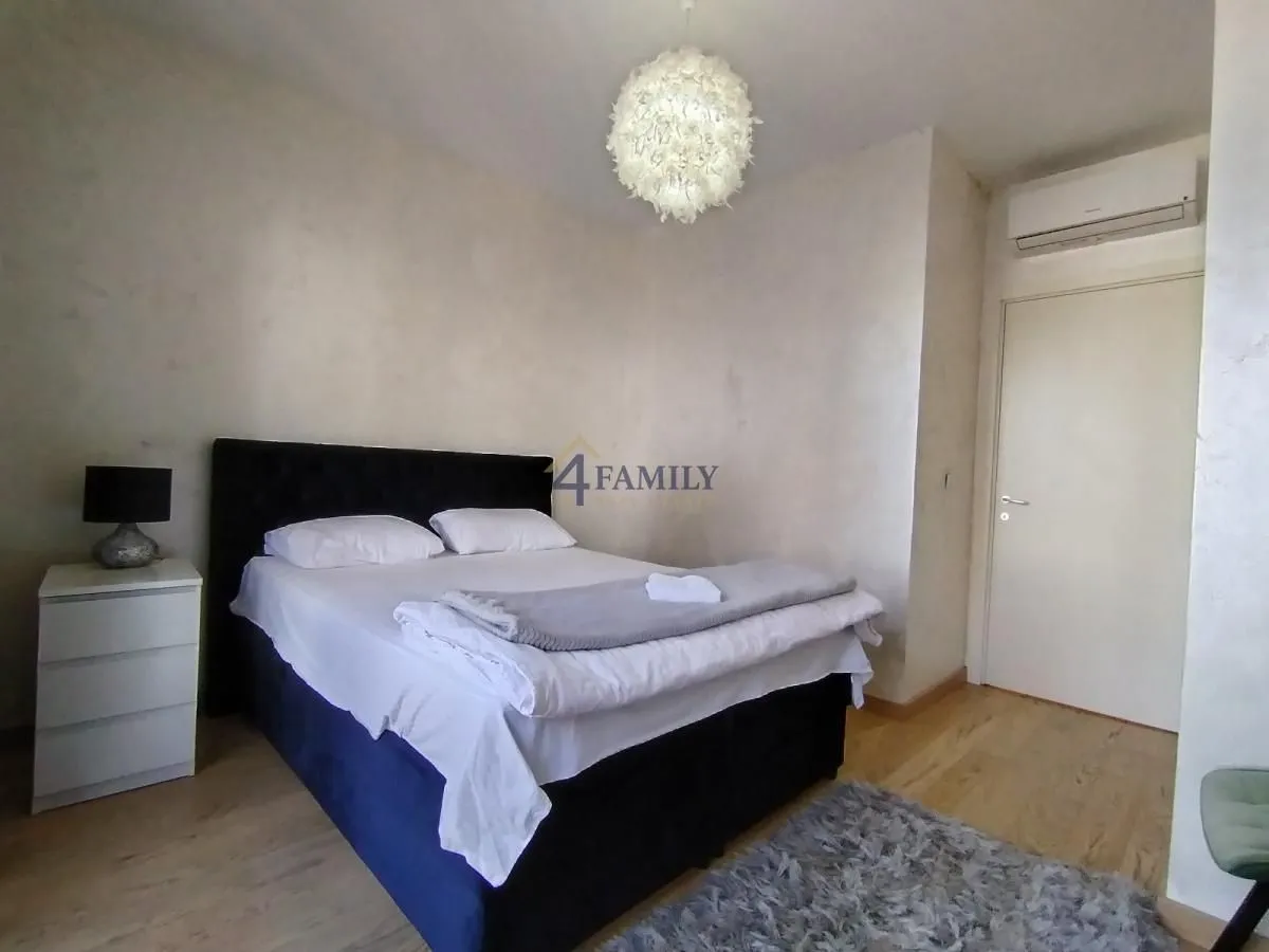 Furnished bedroom with a double bed.