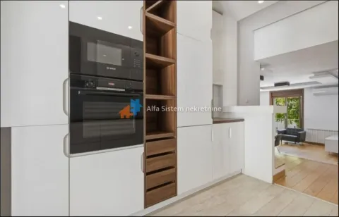 Modern white kitchen with built-in oven and wooden shelving. - image 5