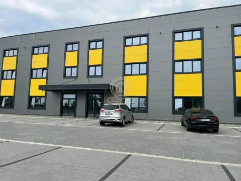 Exterior of the commercial building with parking space in front of the entrance. - image 3