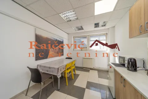 Small kitchen with a dining table and chairs. - image 3