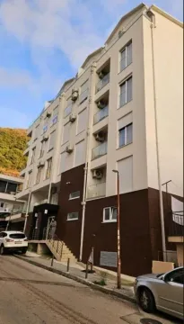 Exterior view of the residential building with balconies and entrance. - image 9