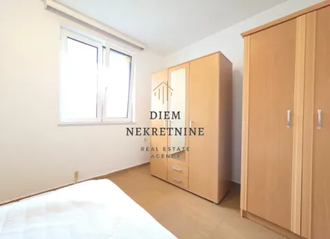 Furnished bedroom with wardrobes and a window. - image 9