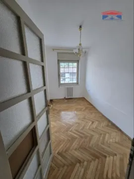 Empty room with parquet flooring and a window, viewed from the doorway. - image 14