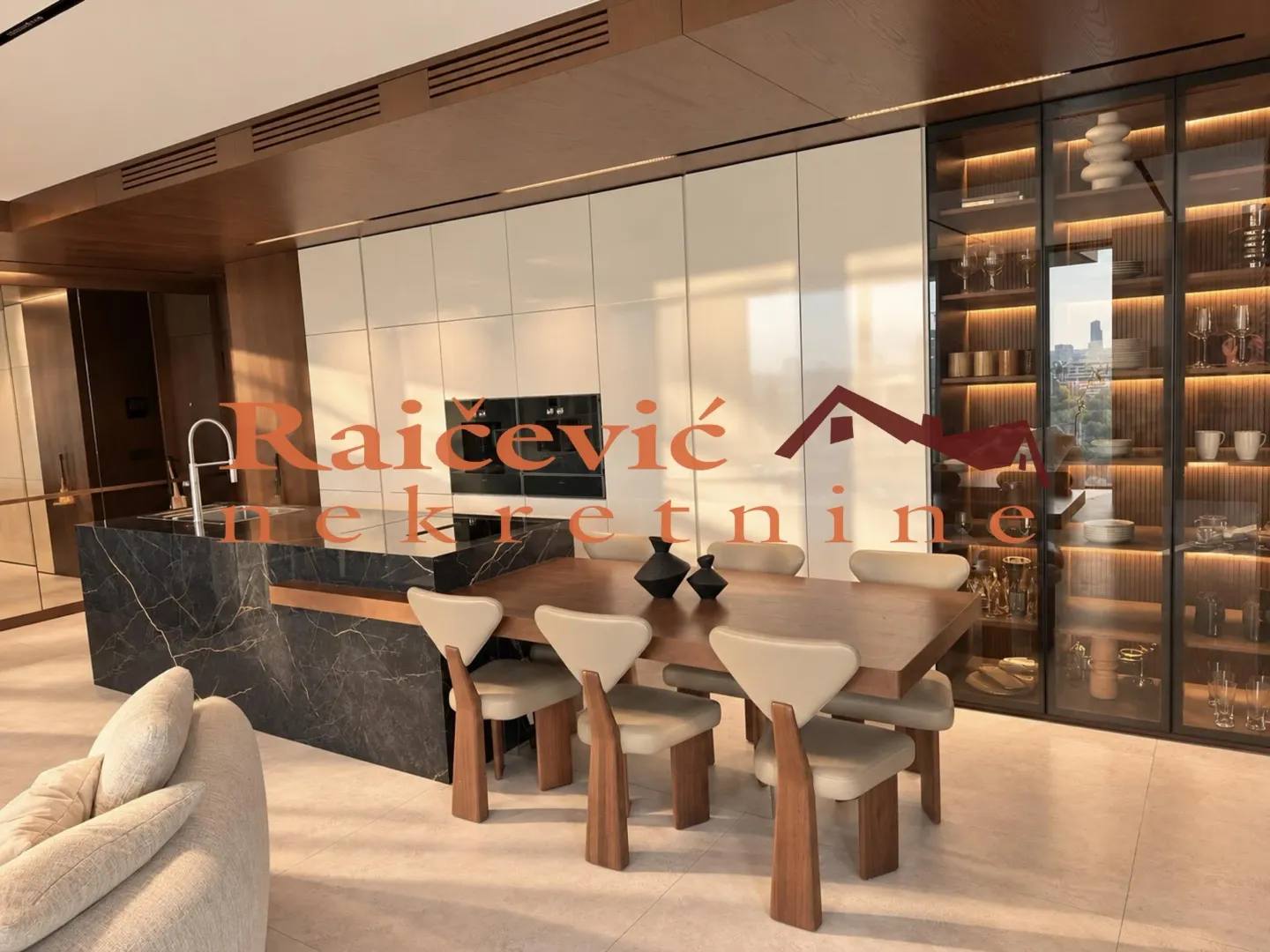 Modern kitchen with an island and dining table.