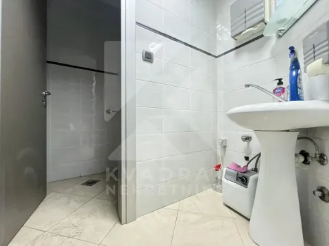 Small bathroom with a pedestal sink and a tiled shower area. - image 29