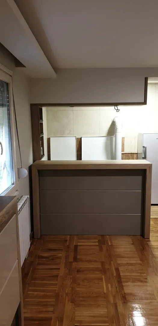 A kitchen bar with wooden details.