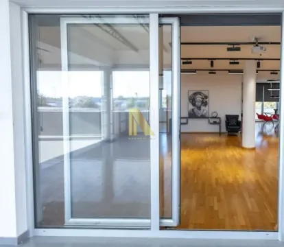 View through large sliding balcony doors into a bright living room interior. - image 11