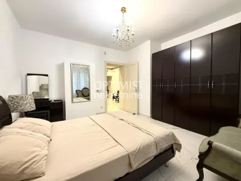 Furnished bedroom with a large double bed and wardrobe. - image 10