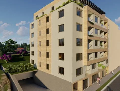 Exterior view of a modern residential building with balconies and a garage entrance. - image 2