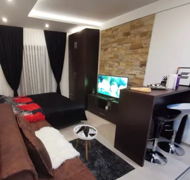 Moderan dnevni boravak sa garniturom, krevetom i šankom. - image 7