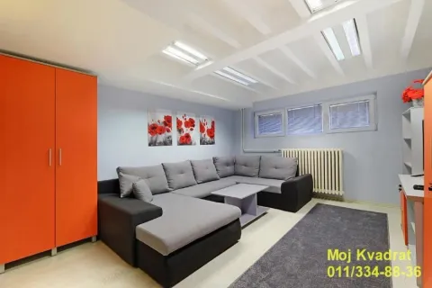 Living room with a corner sofa, wardrobe, and windows. - image 3