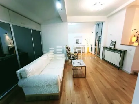 Spacious living room with sofa and wooden floor. - image 10
