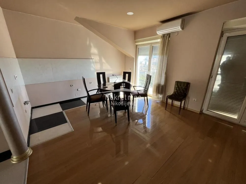 Living room with a dining table and chairs.