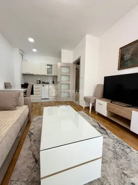Living room connected to the dining area and kitchen. - image 3