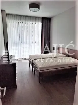 Bedroom with a double bed, dresser, and a window with blinds. - image 9