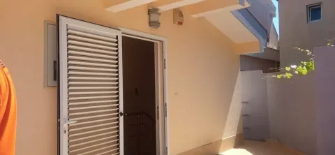 Entrance to the house with white doors and shutters. - image 18
