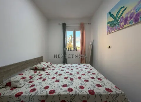Furnished bedroom with a double bed and a window. - image 8