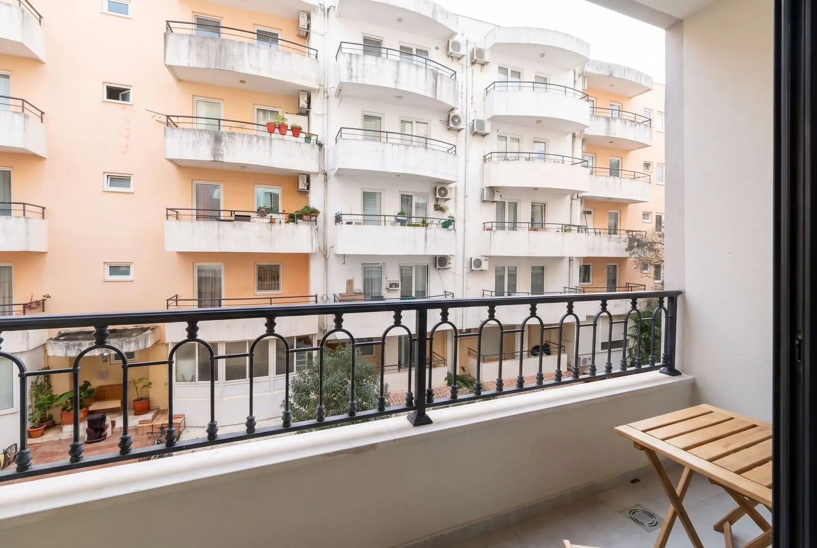 View from the balcony towards neighboring residential buildings.