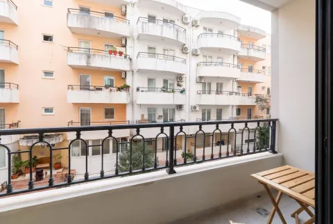 View from the balcony towards neighboring residential buildings. - image 8
