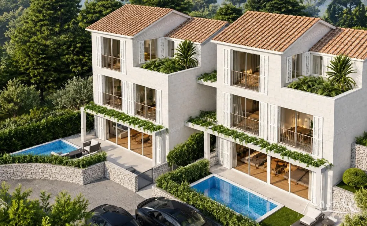 Pogled iz ptičje perspektive na moderne vile sa bazenima i uređenim dvorištem.
