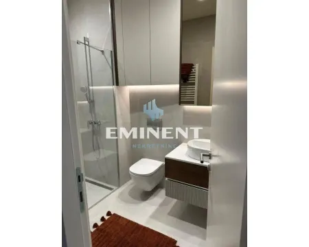 Modern bathroom with a walk-in shower, washbasin, and built-in cabinetry. - image 17