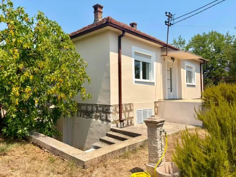 View of the exterior of the house with a yard and entrance. - image 5