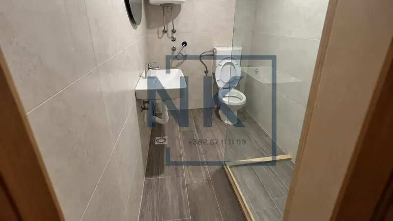A modern bathroom equipped with a walk-in shower.