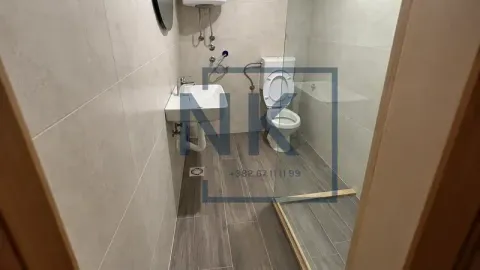 A modern bathroom equipped with a walk-in shower. - image 8
