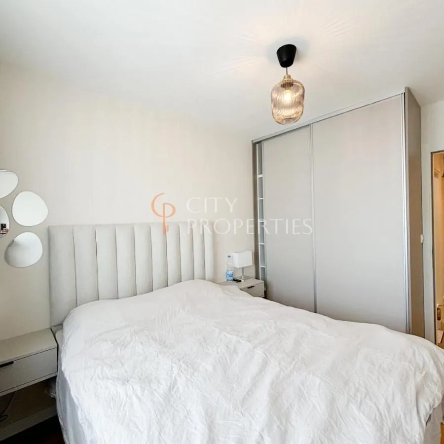 Bedroom with a double bed and a built-in wardrobe.