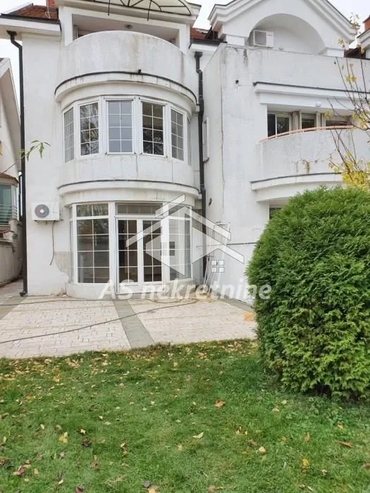 View of the back of the house with a yard.