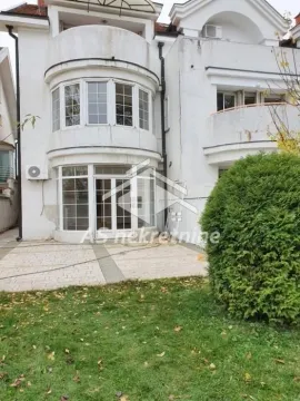 View of the back of the house with a yard. - image 10