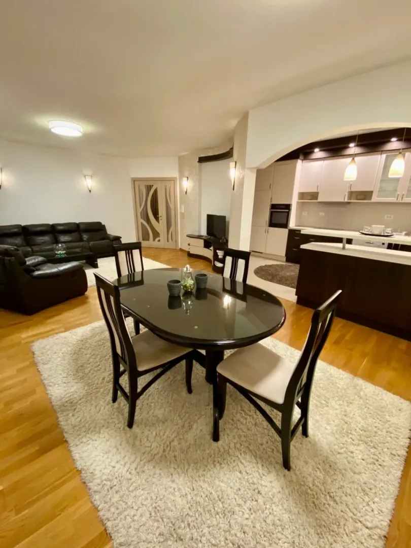 Spacious living room connected to the dining area and kitchen.