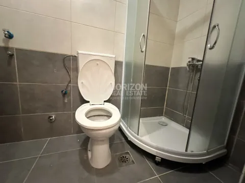 Small bathroom with a shower cabin and sanitary ware. - image 5
