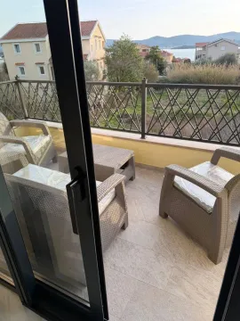 Furnished balcony with seating set and sea view. - image 9