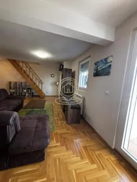 Living room with sofa set, wooden stairs and parquet flooring. - image 7