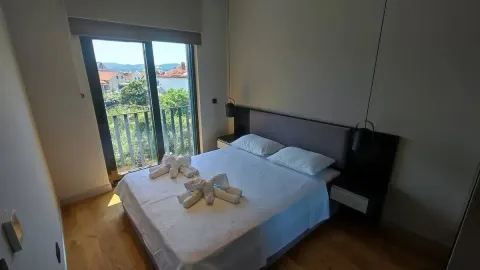 Bedroom with a double bed and access to the terrace. - image 6