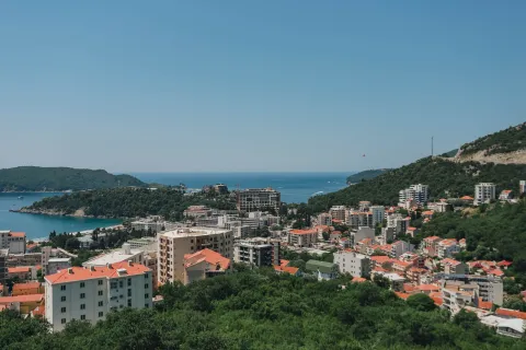View of the city and sea from a terrace or elevated position. - image 12